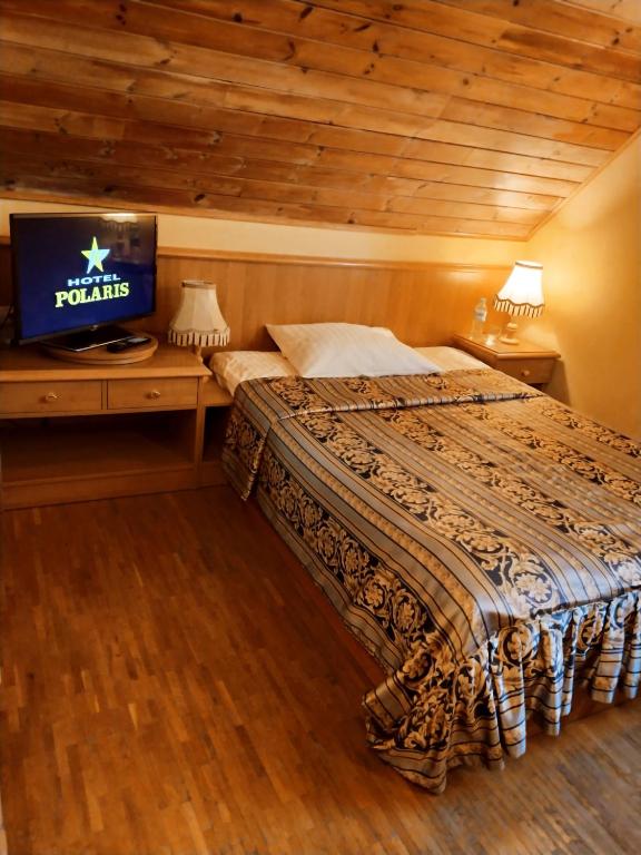 Postel nebo postele na pokoji v ubytování Hotel Polaris