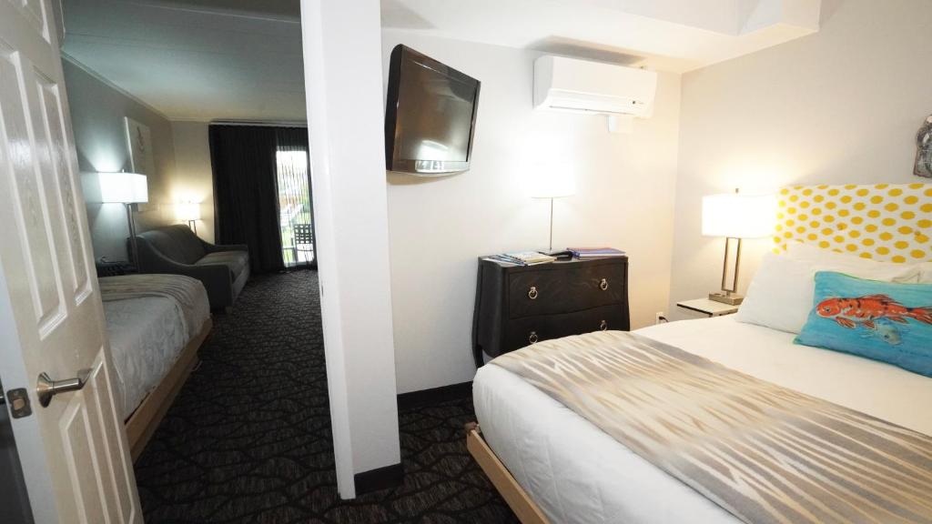 Postel nebo postele na pokoji v ubytování Periwinkle Inn