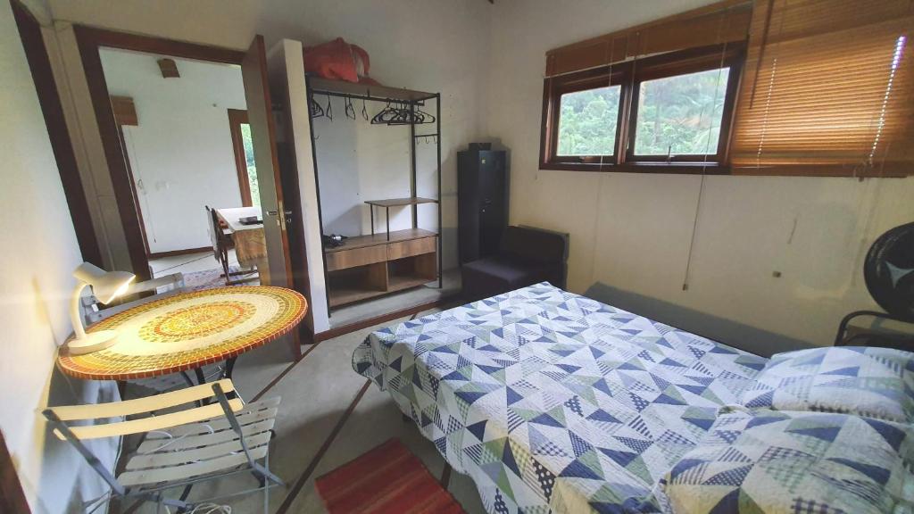 Cama ou camas em um quarto em Casa da Josie em Maresias com piscina no pé da Mata Atlântica - 4 quartos