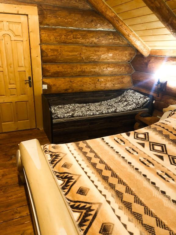 Postel nebo postele na pokoji v ubytování Зимова казка