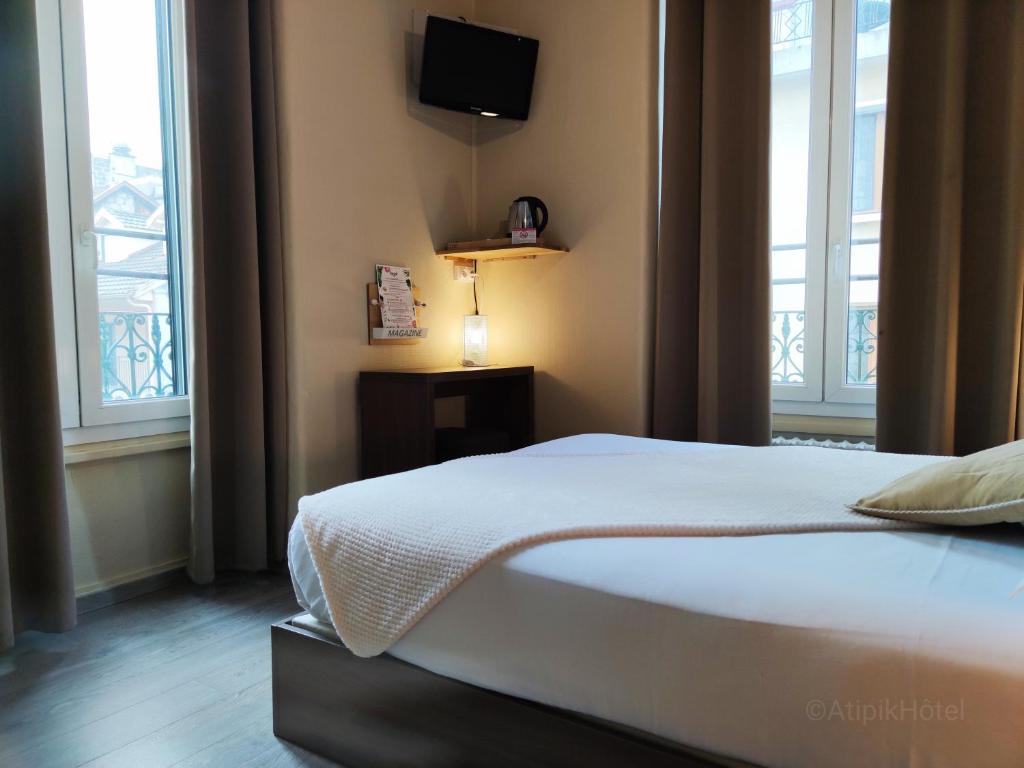 Postel nebo postele na pokoji v ubytování Atipik Hôtel