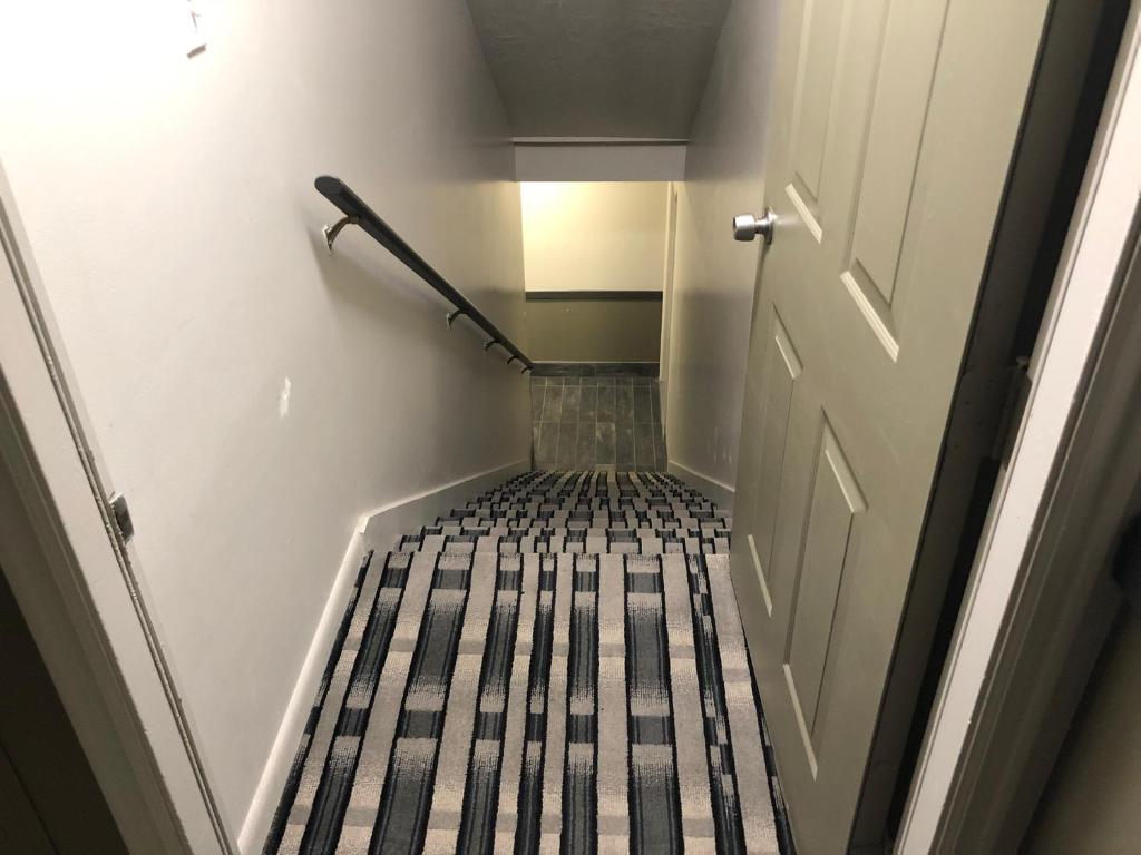 Postel nebo postele na pokoji v ubytování Ameri-Stay Inn & Suites