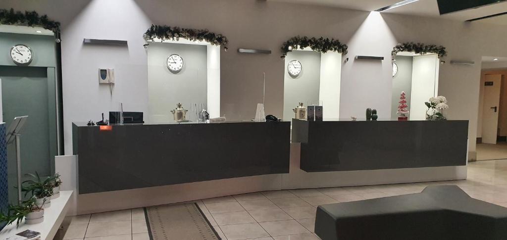 Hol lub recepcja w obiekcie Hotel Artemide