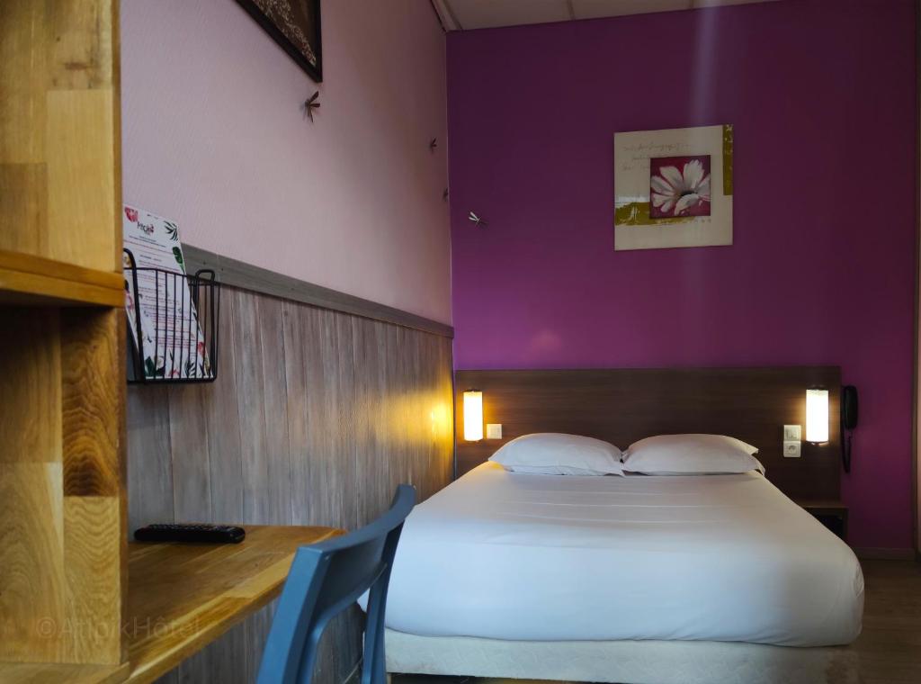 Postel nebo postele na pokoji v ubytování Atipik Hôtel