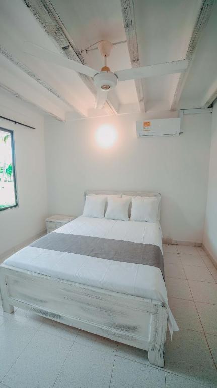 Voodi või voodid majutusasutuse Marbelo Coveñas by Bernalo Hotels toas