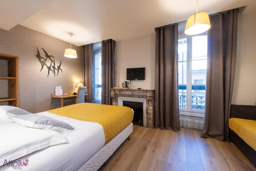 Postel nebo postele na pokoji v ubytování Atipik Hôtel