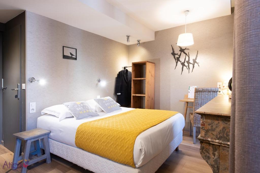 Postel nebo postele na pokoji v ubytování Atipik Hôtel