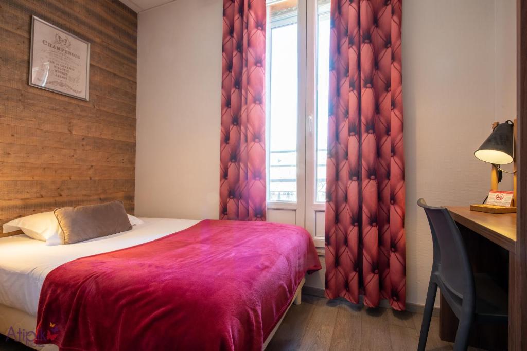 Postel nebo postele na pokoji v ubytování Atipik Hôtel