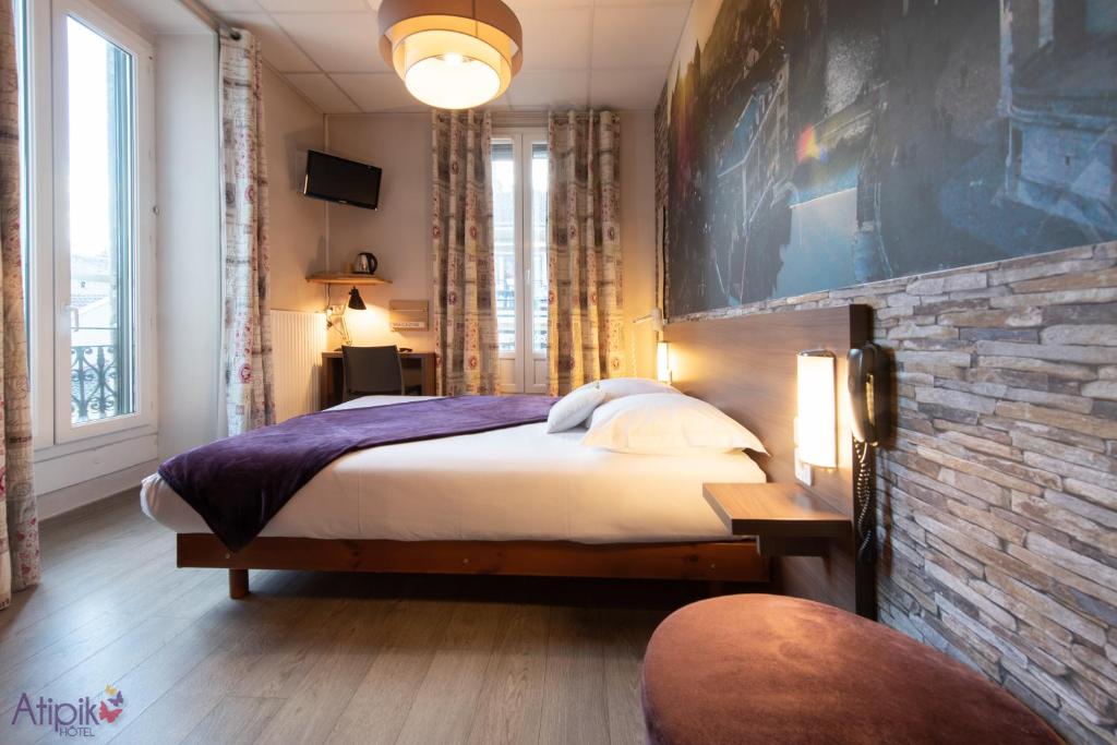 Postel nebo postele na pokoji v ubytování Atipik Hôtel
