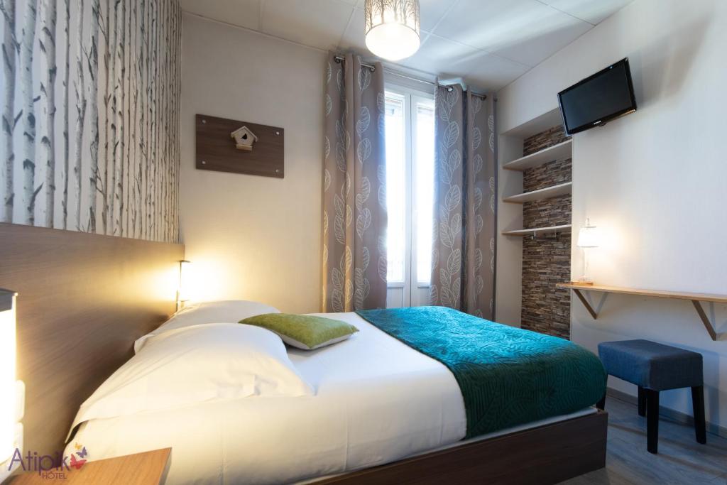 Postel nebo postele na pokoji v ubytování Atipik Hôtel