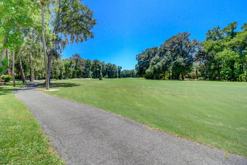 a golf course with a green field and trees at 110 Evian 2 BR Shipyard in Hilton Head Island