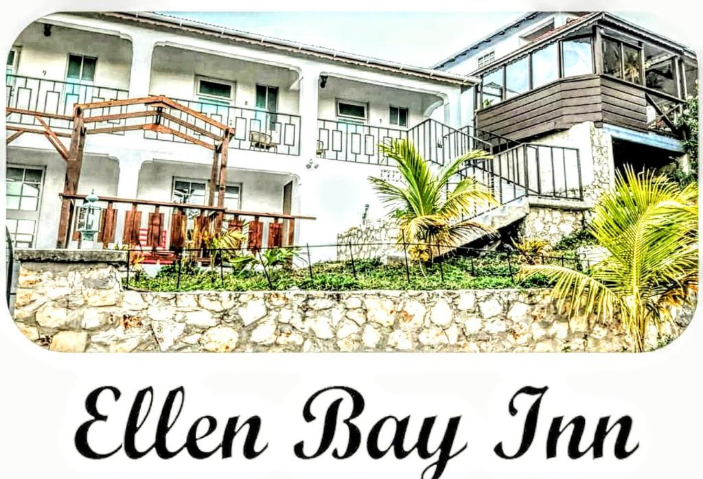 un cartel que lee elfin bay inn en Ellen Bay Inn, en Saint Philips