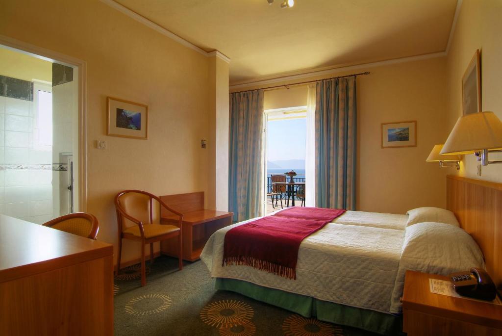 Postel nebo postele na pokoji v ubytování Hotel Kalafati