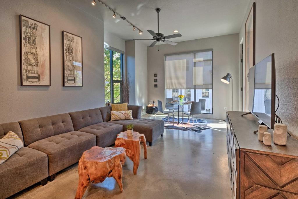 a living room with a couch and a tv at Urban Escape in SoLA with Private Patio! in Austin