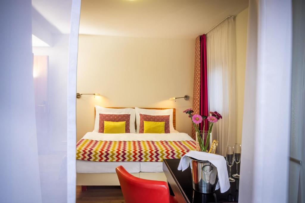 Postel nebo postele na pokoji v ubytování Bellevue Hotel Benešov