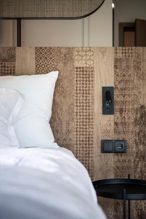 Postel nebo postele na pokoji v ubytování Apfelhotel Torgglerhof