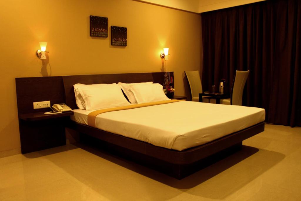 Postel nebo postele na pokoji v ubytování Hotel Solitaire