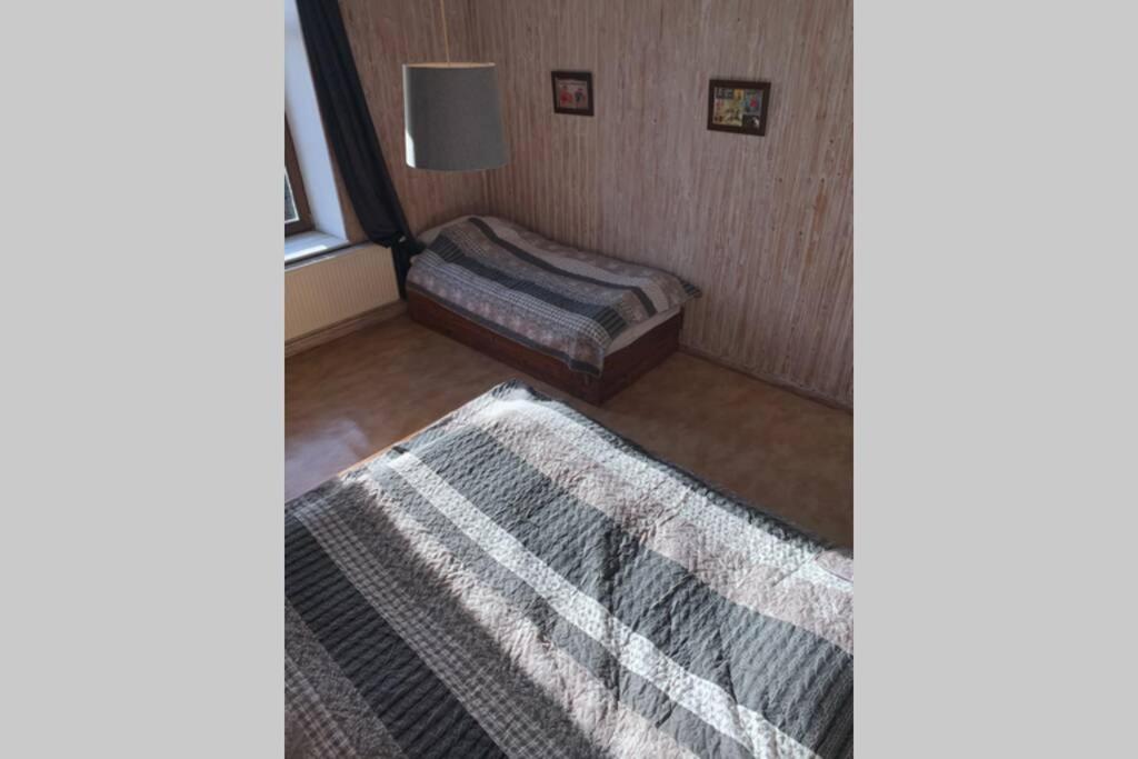 Postel nebo postele na pokoji v ubytování L'ancienne école d'Erpigny