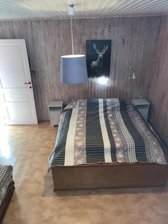 Postel nebo postele na pokoji v ubytování L'ancienne école d'Erpigny