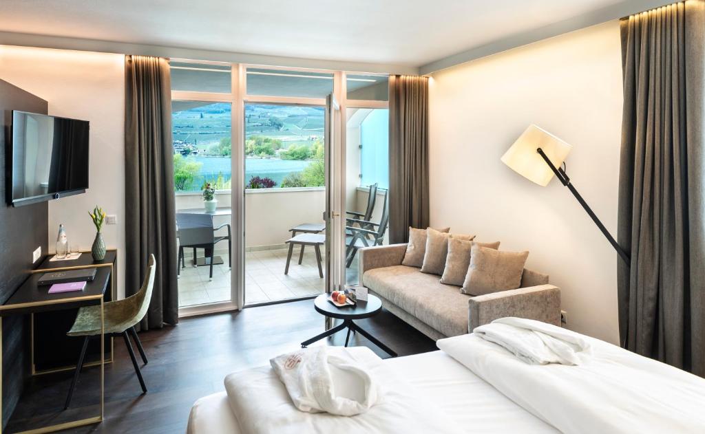 TV a/nebo společenská místnost v ubytování Parc Hotel Am See