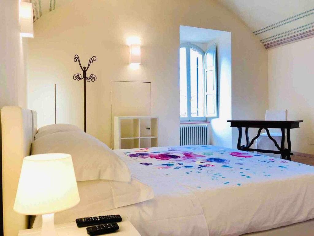 Posteľ alebo postele v izbe v ubytovaní Mavitur Rooms Assisi