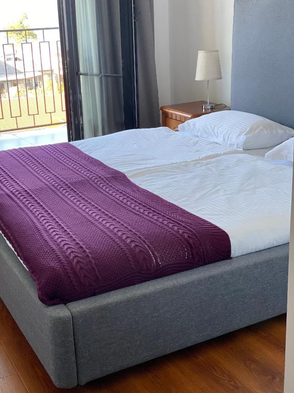 Postel nebo postele na pokoji v ubytování Hotel Homey Kobuleti
