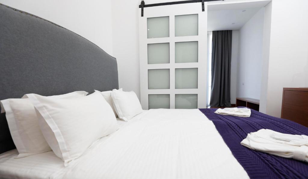 Postel nebo postele na pokoji v ubytování Hotel Homey Kobuleti