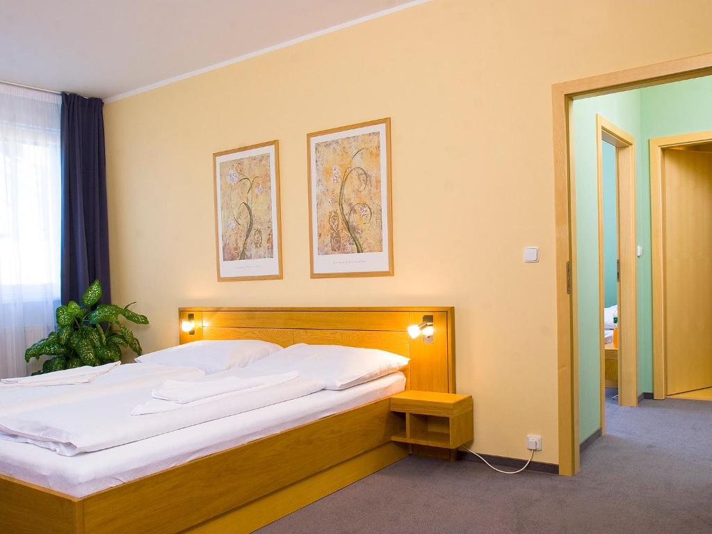 Postel nebo postele na pokoji v ubytování Hotel Trend