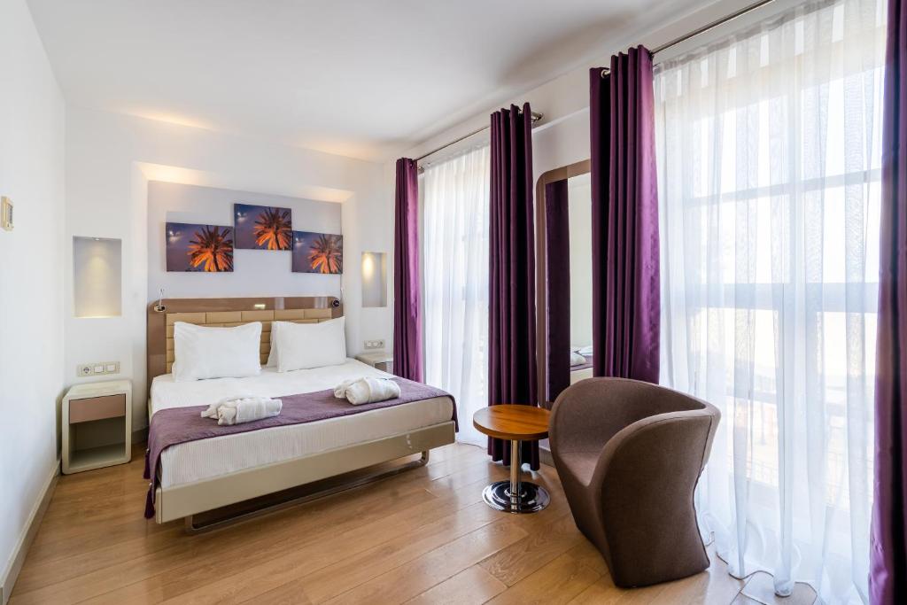 Кровать или кровати в номере Puding Hotel
