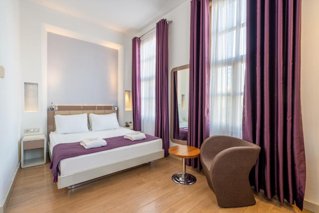 Кровать или кровати в номере Puding Hotel