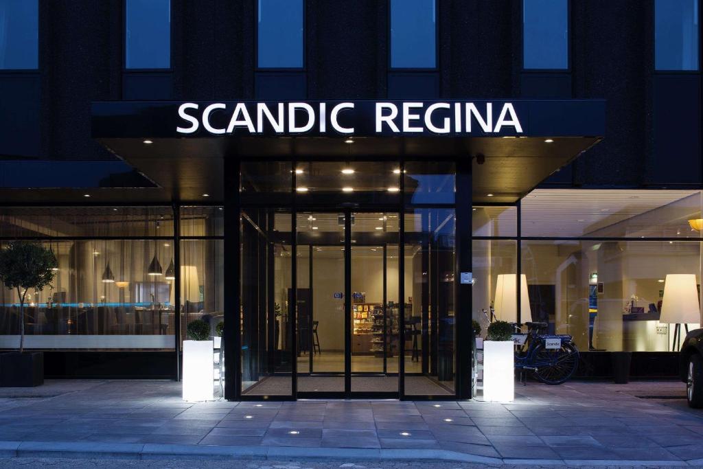 a store front with a sign that reads scania regina at Scandic Regina in Herning