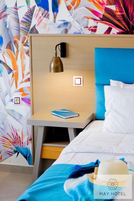 Postel nebo postele na pokoji v ubytování May Beach Hotel