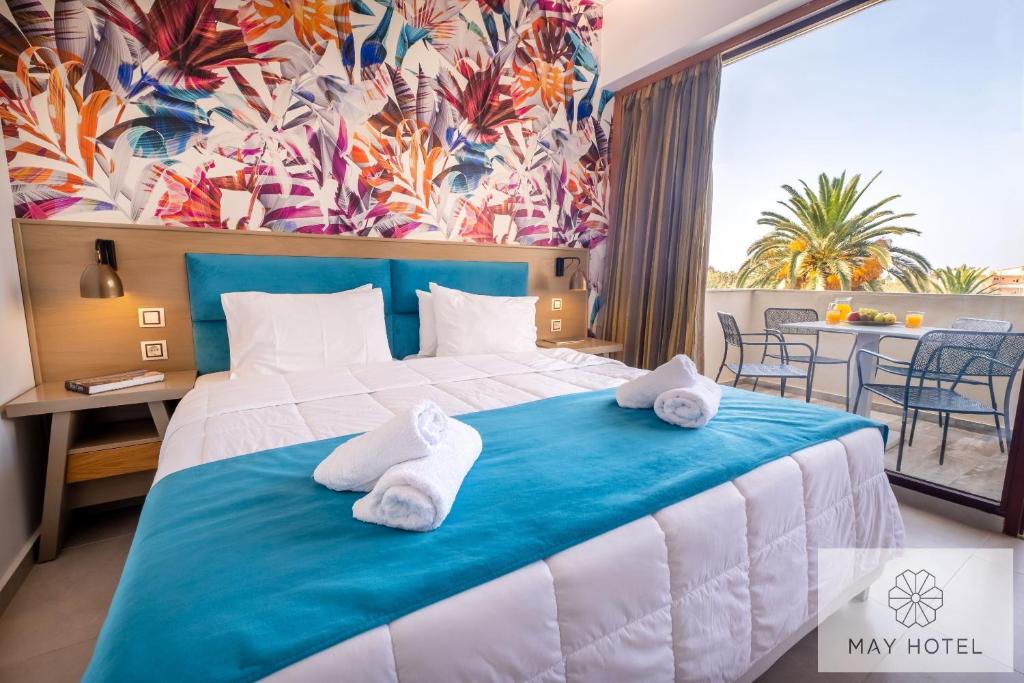 Postel nebo postele na pokoji v ubytování May Beach Hotel