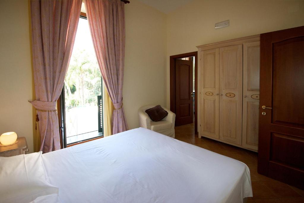 Postel nebo postele na pokoji v ubytování Divina House B&B