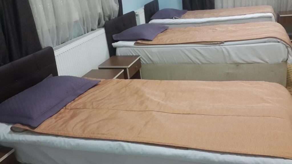 Postel nebo postele na pokoji v ubytování Esin Pansiyon