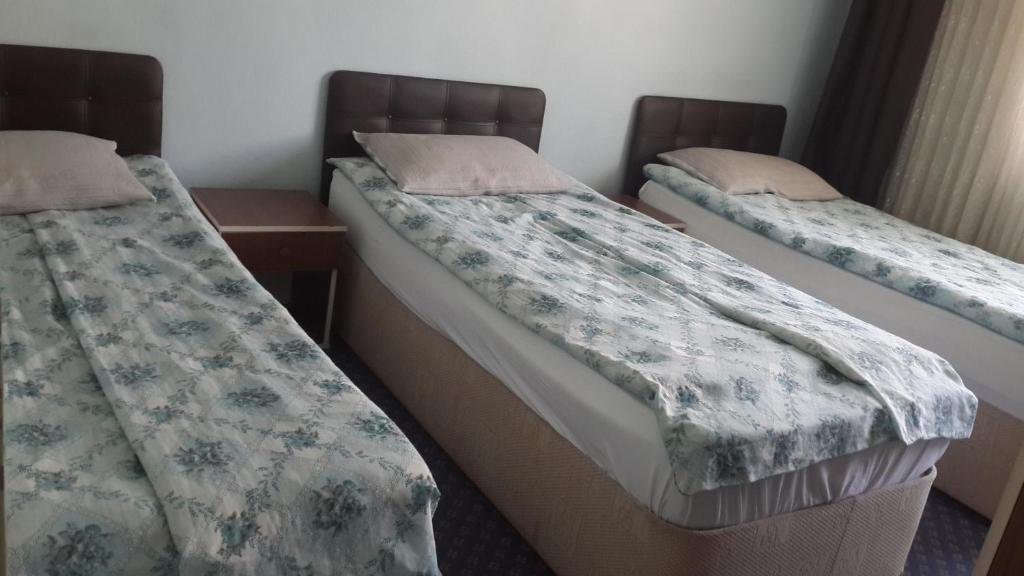 Postel nebo postele na pokoji v ubytování Esin Pansiyon