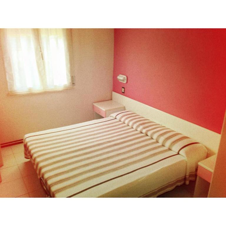 Postel nebo postele na pokoji v ubytování Hotel Zenit