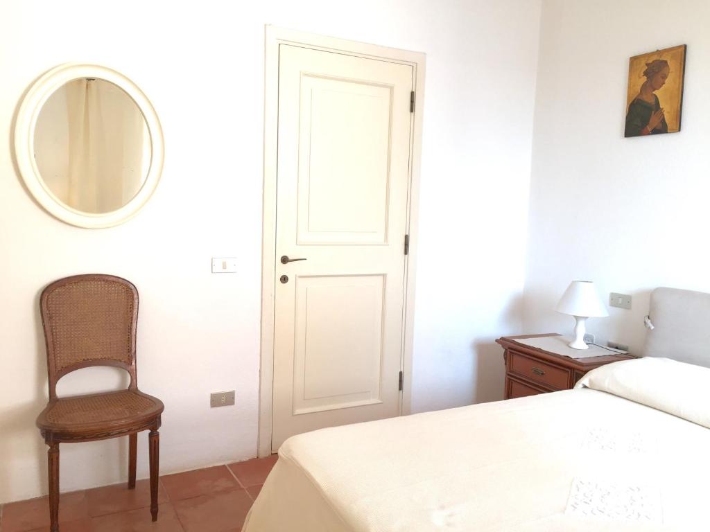 Łóżko lub łóżka w pokoju w obiekcie Sea & Beach Apartments Porto Cervo Costa Smeralda