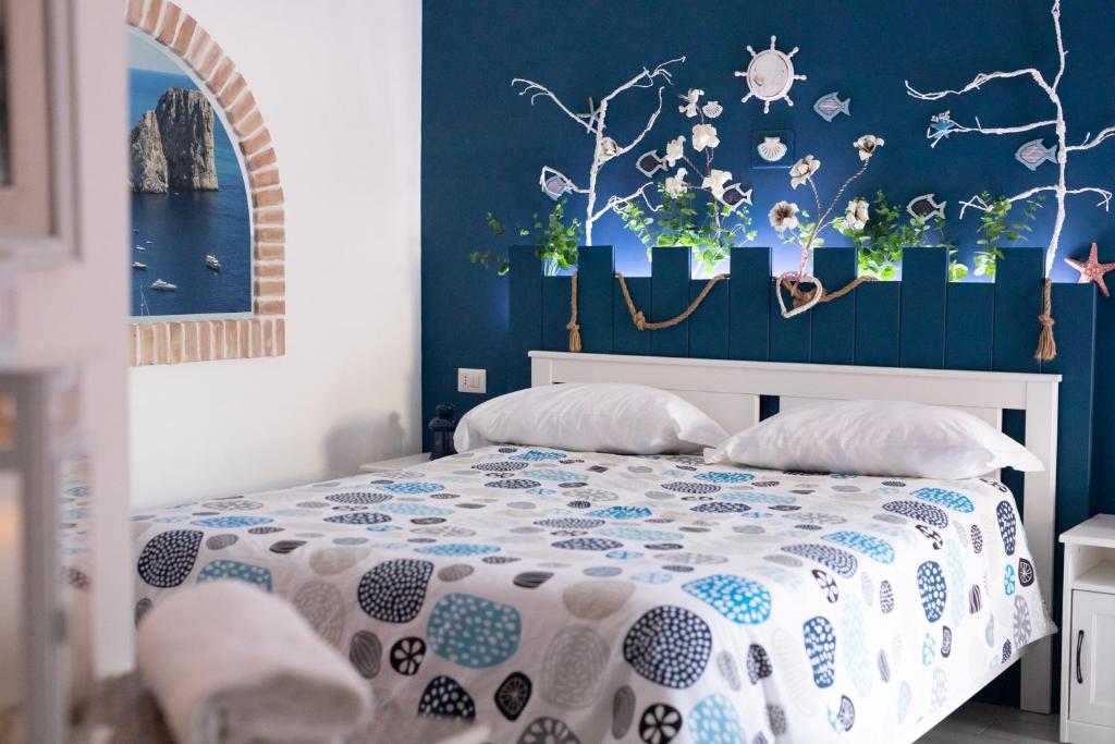 Łóżko lub łóżka w pokoju w obiekcie Stabiae Luxury Rooms
