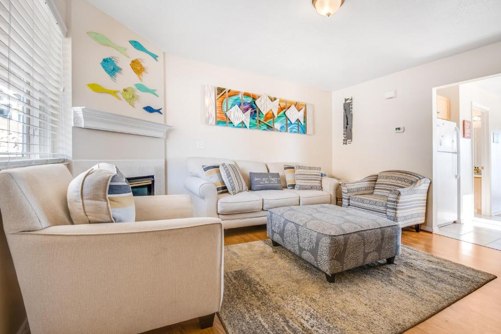 a living room with two couches and a table at Bear Lake View in Garden City