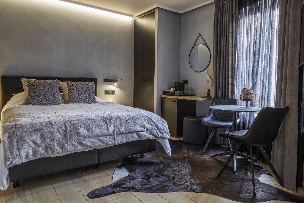 Postel nebo postele na pokoji v ubytování Hotel ONIRO - Luxury Rooms & Wellness Suites