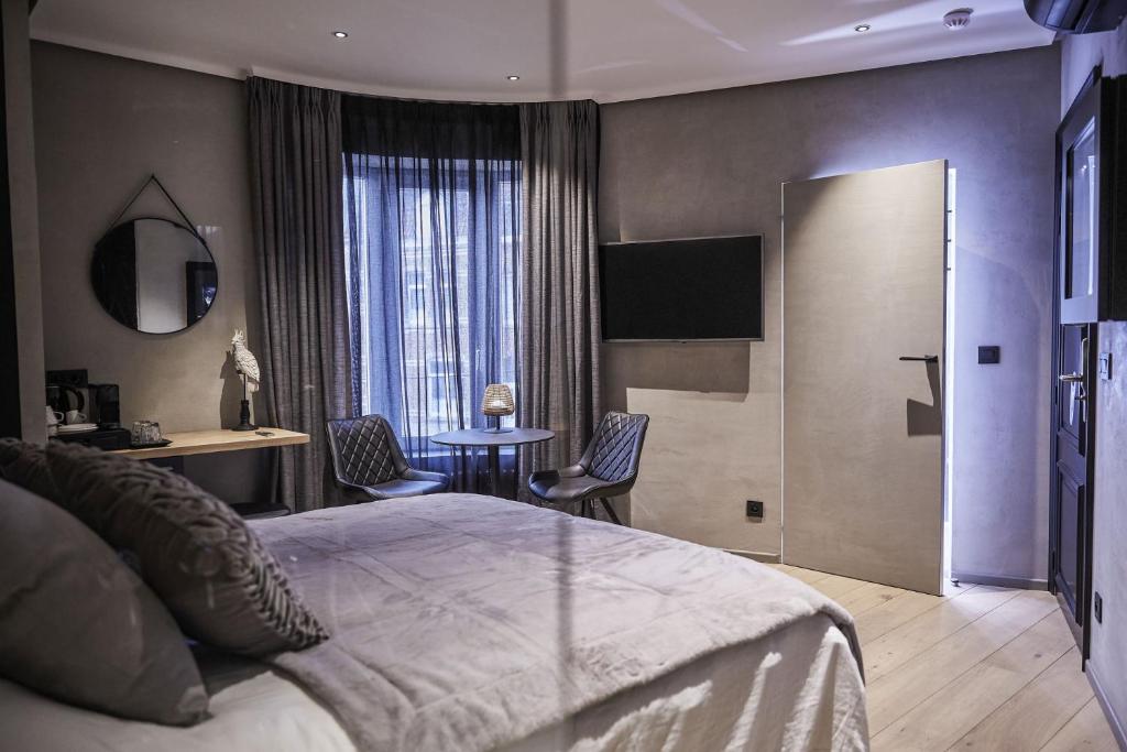 Postel nebo postele na pokoji v ubytování Hotel ONIRO - Luxury Rooms & Wellness Suites
