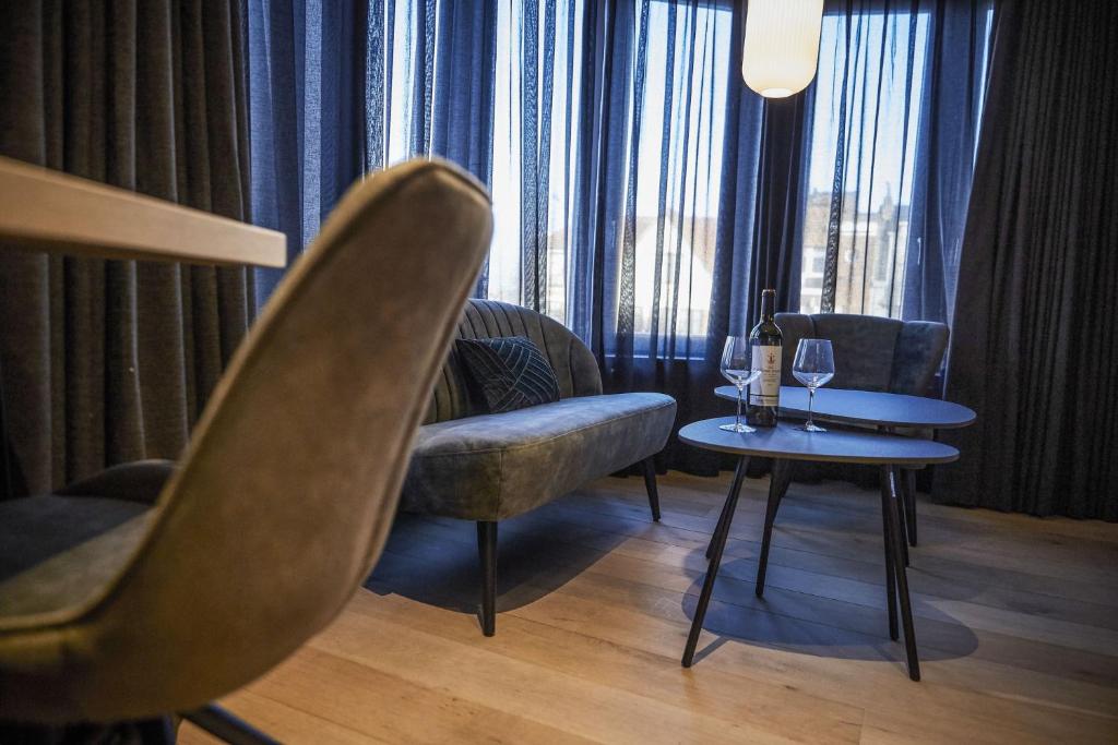 Posezení v ubytování Hotel ONIRO - Luxury Rooms & Wellness Suites
