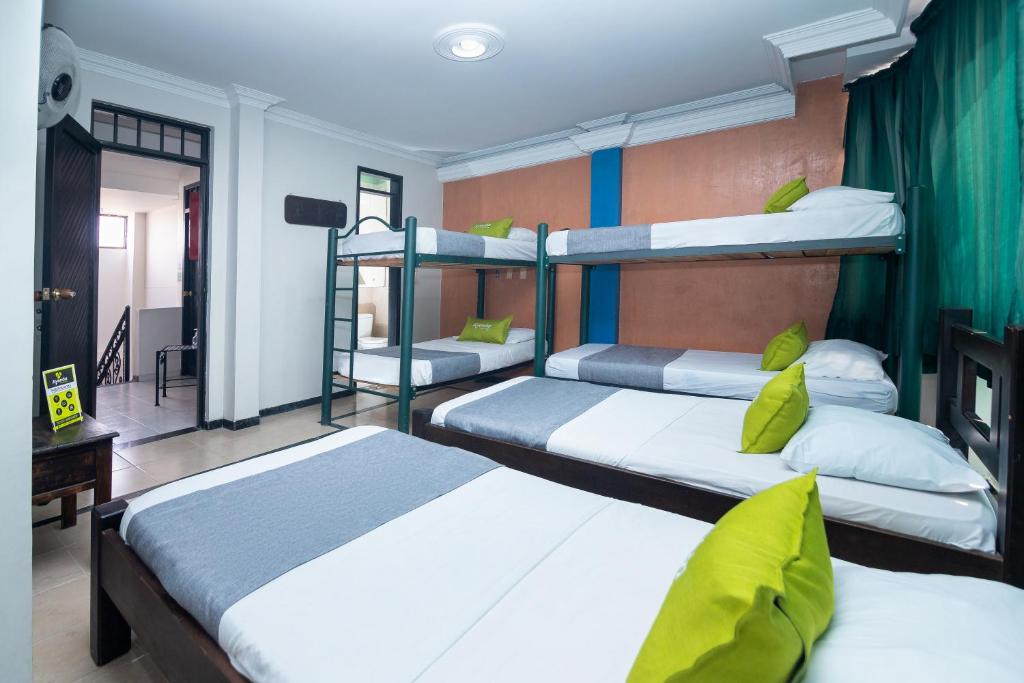 Postel nebo postele na pokoji v ubytování Hotel Ayenda Calypso 1142