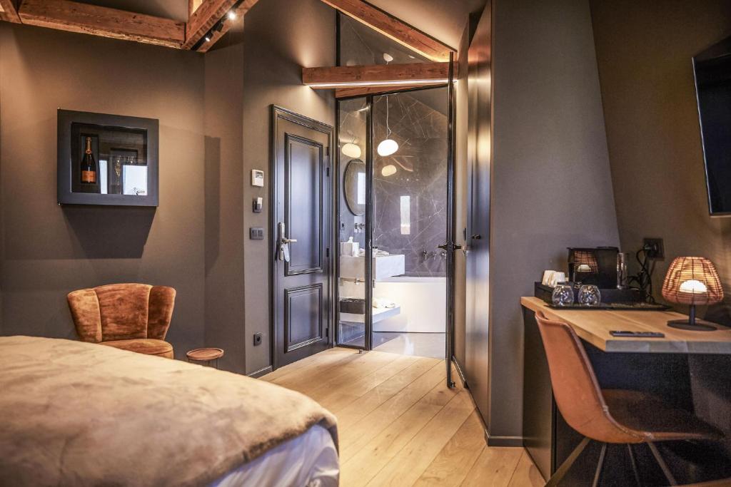 Postel nebo postele na pokoji v ubytování Hotel ONIRO - Luxury Rooms & Wellness Suites