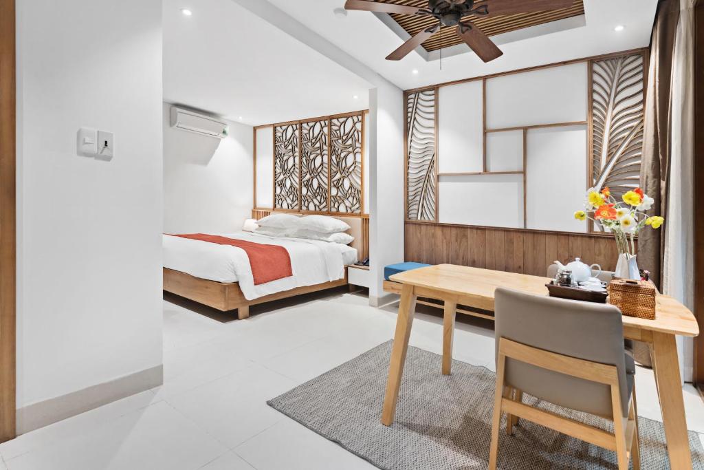 Giường trong phòng chung tại Tam House Villa Hotel