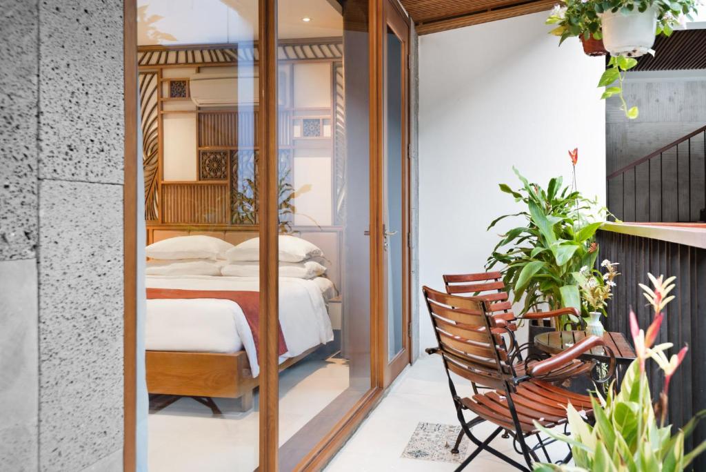 Giường trong phòng chung tại Tam House Villa Hotel