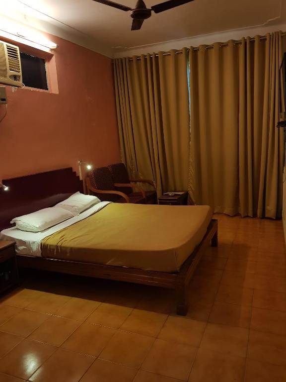 Postel nebo postele na pokoji v ubytování The Sincro Hotel
