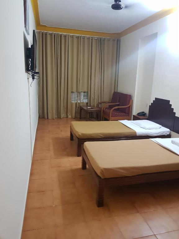 Postel nebo postele na pokoji v ubytování The Sincro Hotel
