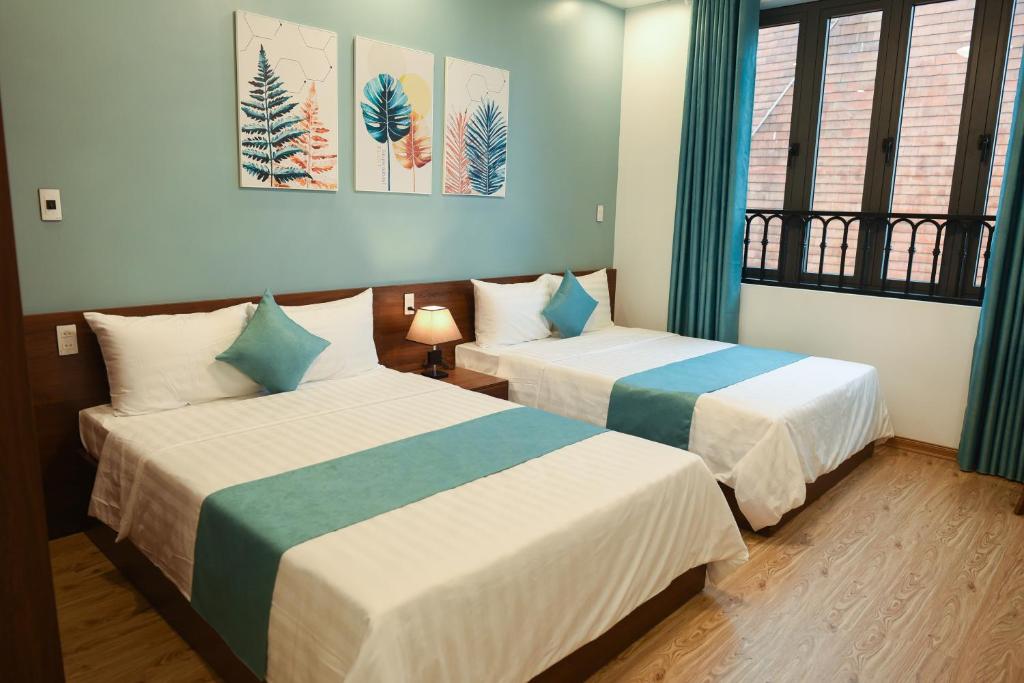 Giường trong phòng chung tại AnAn Homestay Huế